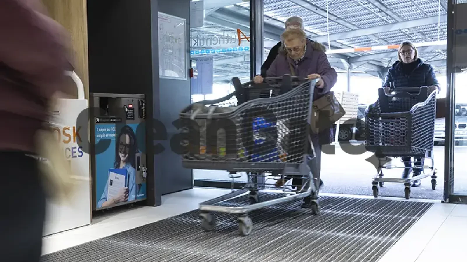 Supermarket entrance with a guided route