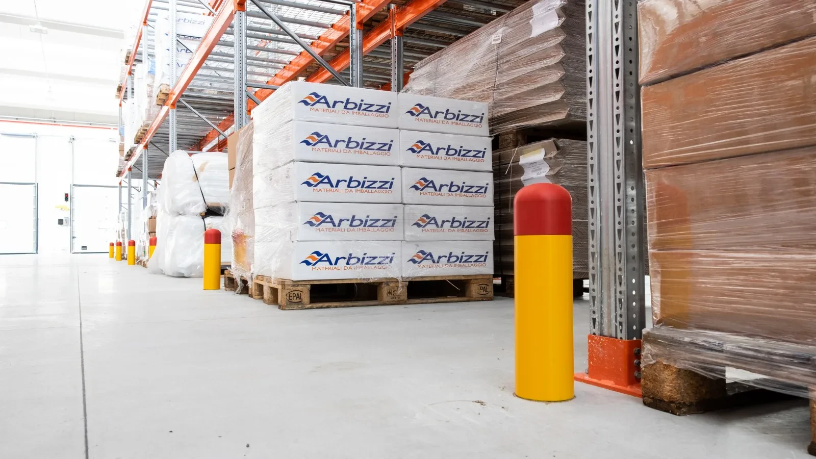 Bollard beside an upright and palletised goods