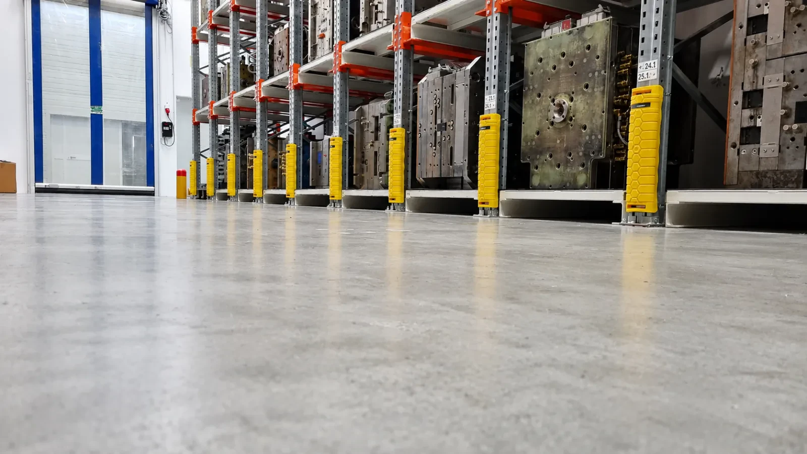 Protective bollards at the end of a rack row